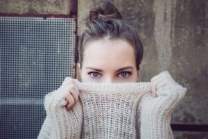 Woman hiding half her face